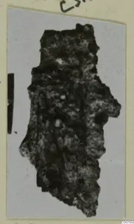 Heavily corroded iron object from Amathus tombs, its shape hard to make out