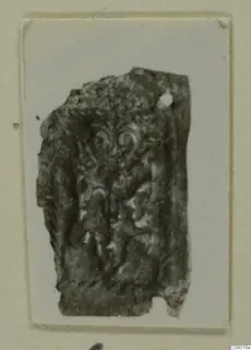 Fragment of silver sheet with a raised scroll and foliage pattern, from Amathus