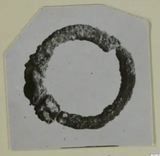 Corroded bronze ring from Amathus, shown in close view on a card mount