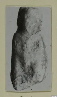 Weathered stone figure fragment from Amathus with a rounded head and broad body, shown in a small print