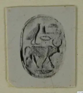 Glyptic from Amathus: an oval seal with an incised design, photographed on a card mount