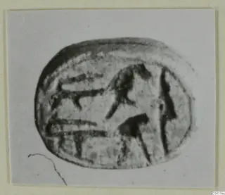 Engraved oval seal from Amathus, photographed face-on on a card mount