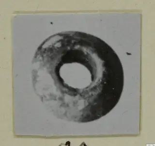 Ring-shaped stone object with a central hole, from Amathus