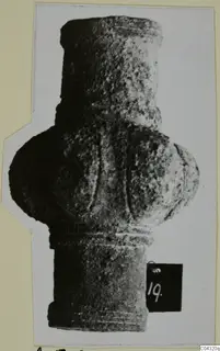 Bronze tool from Amathus: a grooved, cylindrical object with a bulbous middle, photographed upright