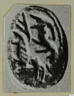 Oval engraved seal or gem from Amathus, shown enlarged with a pattern of raised and incised lines.