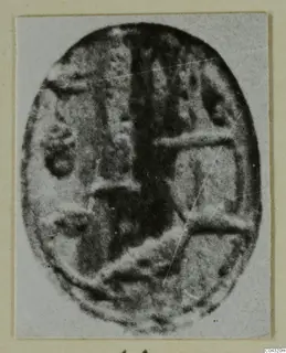 Oval object with a pattern of raised bands and a dark central stripe, from Amathus