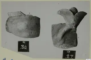 Two vessel fragments with number labels, one with a projecting handle-like part and incised pattern, from Amathus
