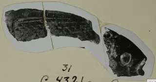 Two dark, corroded fragments on a white photo mount, Amathus jewellery etc.