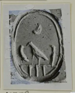 Enlarged photograph of an oval engraved seal or gem, mounted on a card