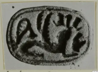 Oval seal-stone with incised signs on its flat face, from Ayia Irini