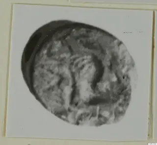 Glyptic find from Ayia Irini: a small oval carved object seen close up
