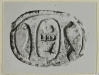 Scarab seal from Ayia Irini with incised signs in oval panels on its flat base