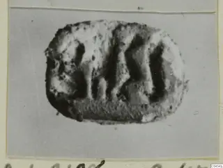 Engraved stone seal with deep vertical grooves, from Ayia Irini