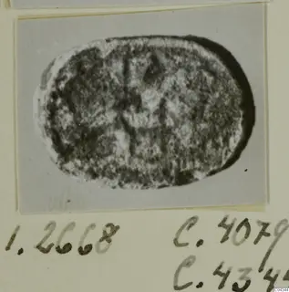 Oval engraved seal or gem, shown as a close photograph mounted on a card.