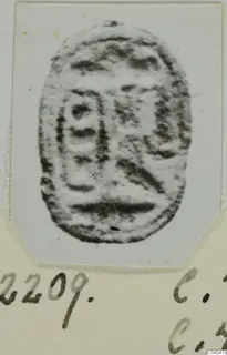 Oval engraved seal from Ayia Irini, photographed on a pale card mount