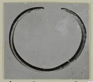 Open silver bracelet from Vouni 292, with tapered ends decorated with incised lines