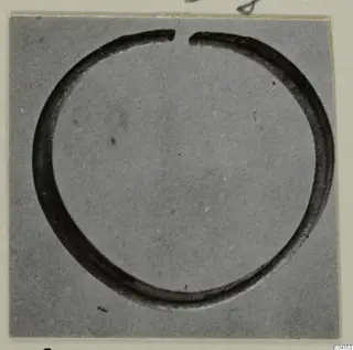 Silver bracelet from Vouni, a thin open circular band photographed flat