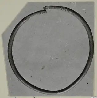 Silver bracelet from Vouni, an open ring with a gap at the top, shown against a grey background