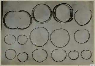 Silver rings from Vouni: about fifteen open hoops of varying size arranged in three rows