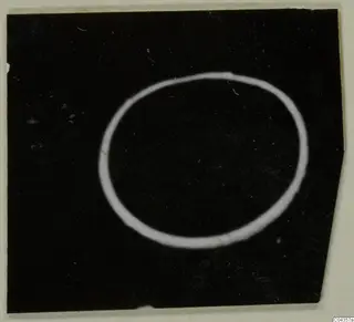 Gold ring from the Kastros tombs at Lapithos, shown against a black background.