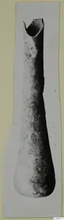 Blown glass vase, tall and narrow, with an uneven rim at the top