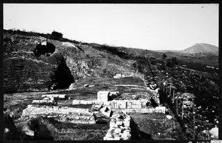 Excavated theatre at Soli with exposed stone blocks and walls, viewed from the east