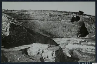 The theatre at Soli viewed from the east, with tiered stone seating cut into a slope.