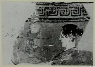 Pottery sherd with a stepped band pattern above and a painted head in profile facing left