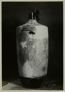 Tall pottery vessel with a loop handle, a painted figure in profile and a patterned band below the neck