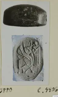 Two views of a dark stone seal, a side view of the object and an enlarged view of its carved oval face, from Ayia Irini