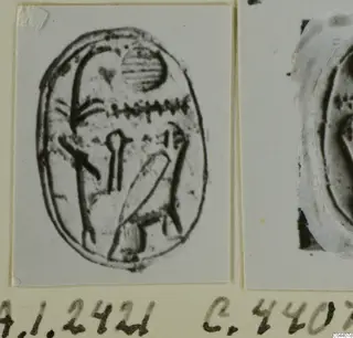 Print of an engraved oval seal with a striped disc and zigzag design, mounted beside a partial impression.