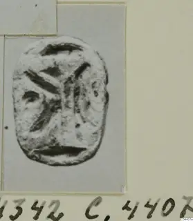 Stone seal or gem from Ayia Irini with an incised design of curved and diagonal strokes