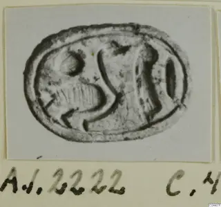 Oval seal-gem with an engraved design, photographed and mounted on a card with a handwritten label, from Ayia Irini