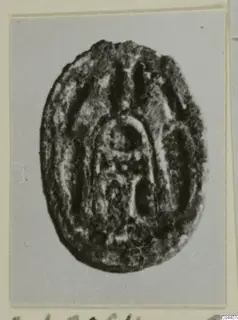 Oval seal or gem with an incised arched design, from Ayia Irini
