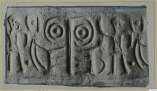 Seal impression with two concentric circles and figure-like shapes, recorded as Glyptic, Nicosia