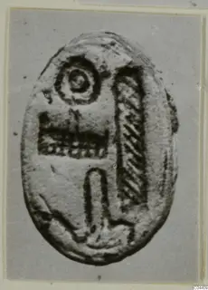 Oval seal or gem from Ayia Irini with an incised design of a ring, hatched panels and an arch motif