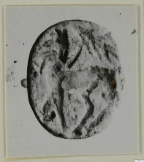 Engraved oval seal or gem in stone, from Ayia Irini, shown on a pale card mount