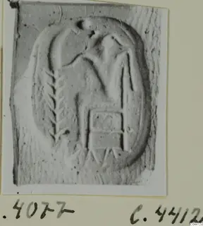 Seal design in an oval field showing a figure and linear motifs, photographed on a card mount