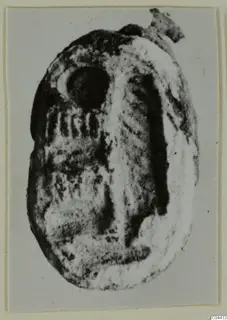 Glyptic (seal or gem) from Ayia Irini, an oval engraved object photographed on a card mount