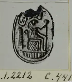 Oval engraved seal or gem from Ayia Irini showing a seated figure and a staff-like object