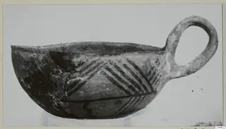 Pottery White Painted III-2 bowl from Lapithos, with one loop handle and dark painted bands in a chevron pattern