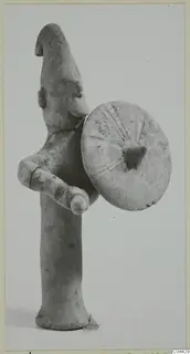Terracotta figurine of a standing figure holding a round shield, Ayia Irini