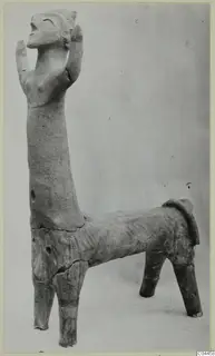 Terracotta figure with a human-like upper body and raised arms, set on a four-legged animal body