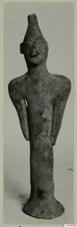 Terracotta figurine of a standing human figure from Ayia Irini