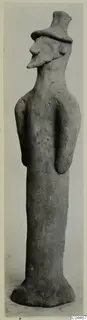 Terracotta figure of a standing figure with a tall flat-topped headdress, from Ayia Irini