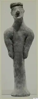 Terracotta standing figurine with a rolled cap or headband, arms held at the sides and a flared base.