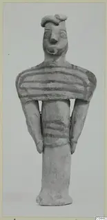 Terracotta figurine from Ayia Irini with painted horizontal bands on the body, standing upright.