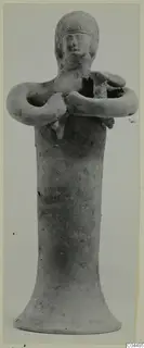 Terracotta figurine of a standing figure with arms folded across the chest, from Ayia Irini