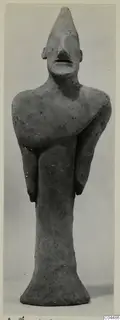 Terracotta figurine of a standing figure with arms folded across the chest, from Ayia Irini