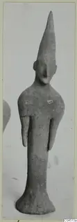 Terracotta figurine of a standing figure with a tall conical head and short stub arms